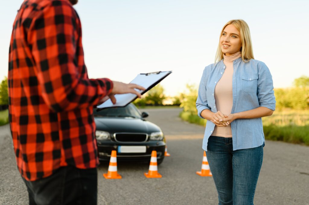 Woman and instructor with checklist on road